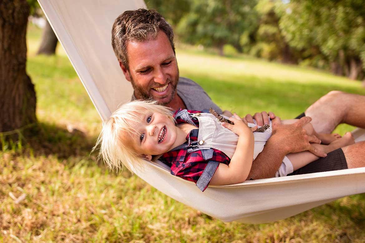 Dad and son in hammock