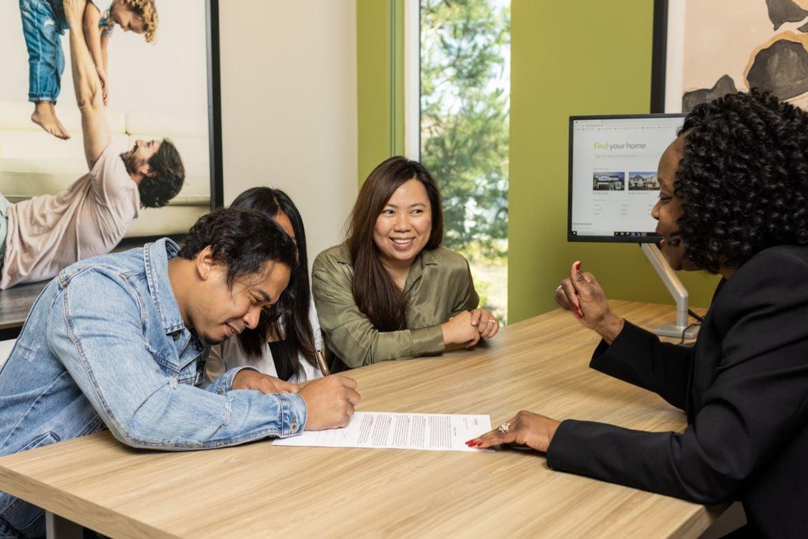 Homebuyer Signing Purchase Agreement