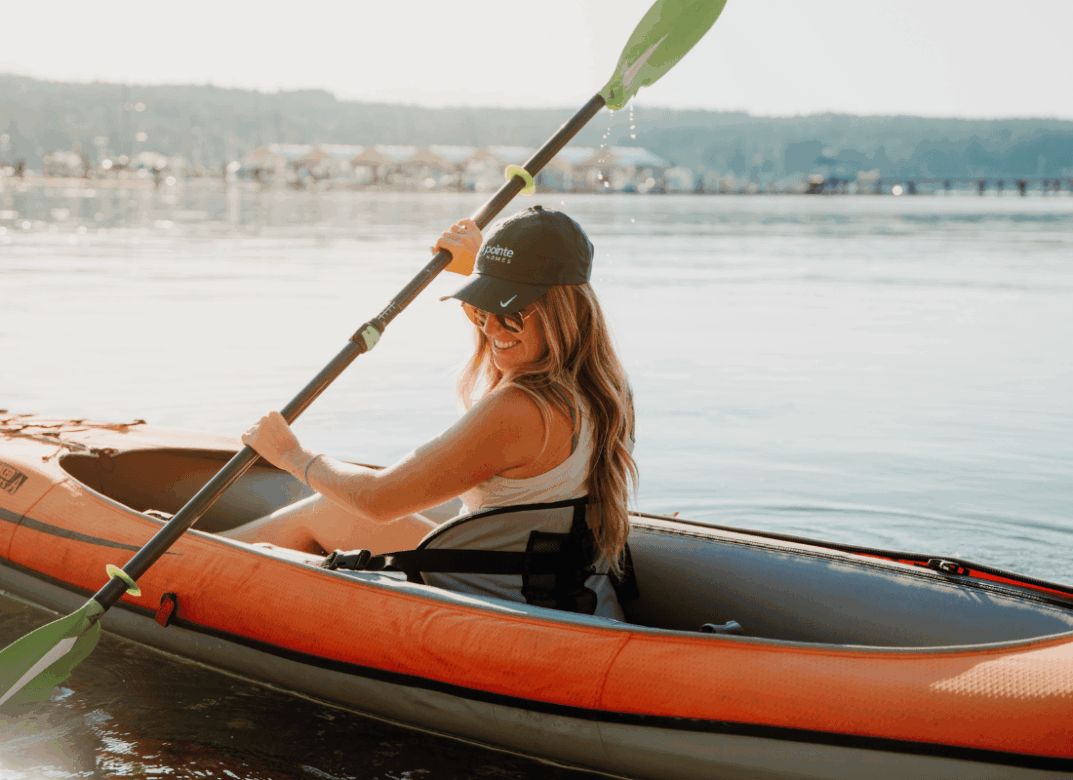 A woman kayaking in the lake.