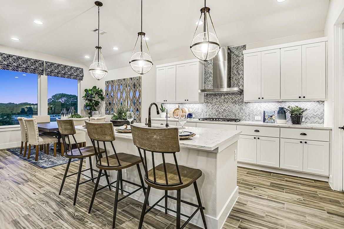 Model home kitchen with white cabinets