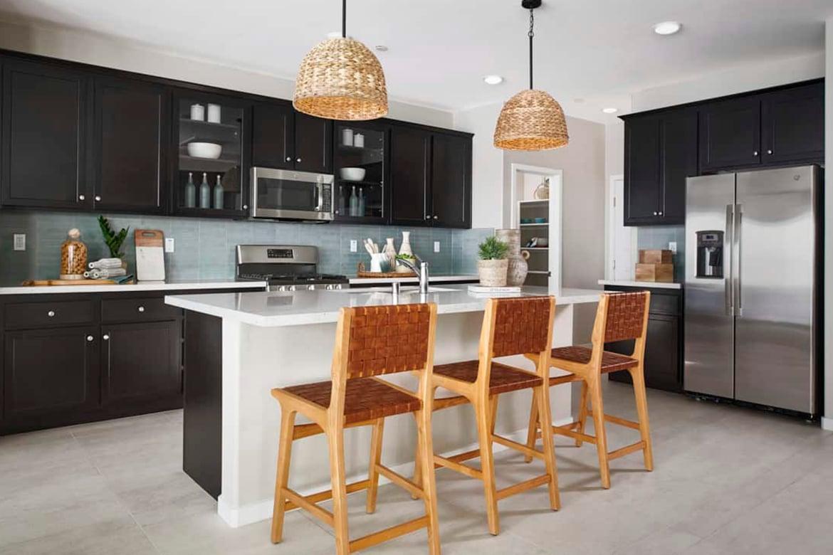 Model home kitchen with dark cabinets