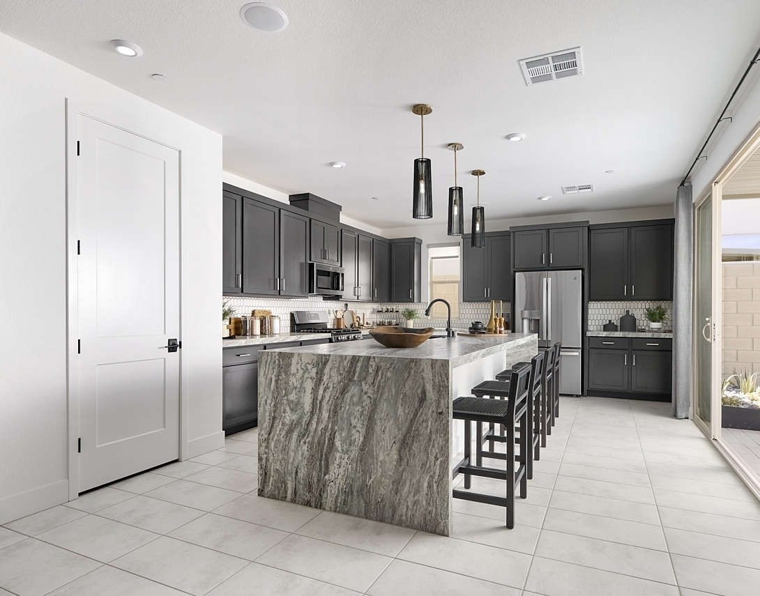 vela tri pointe kitchen model home with black cabinets and grey granite 